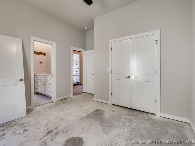 unfurnished bedroom featuring ensuite bath and a closet