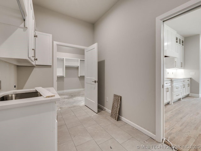 washroom with cabinets and electric dryer hookup