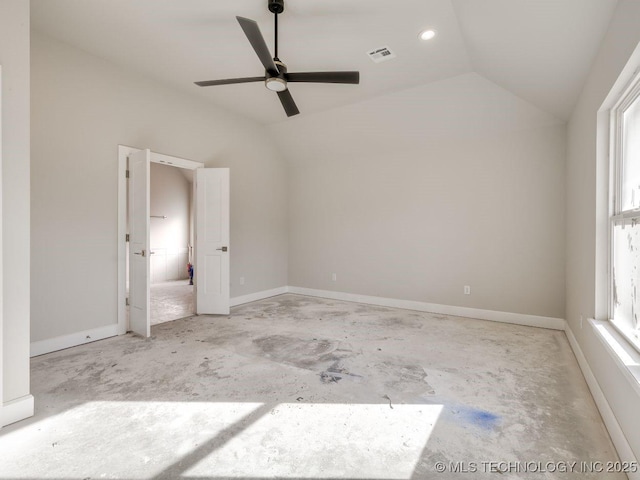 spare room featuring lofted ceiling and ceiling fan