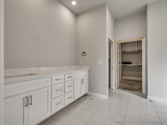 bathroom with vanity and tile patterned floors