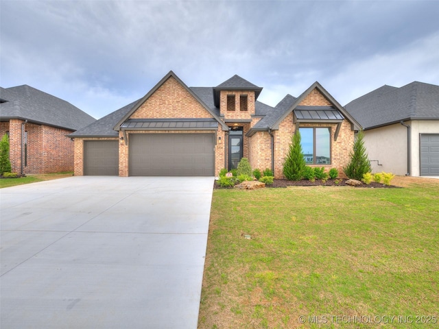 craftsman inspired home featuring roof with shingles, driveway, brick siding, a front yard, and a garage