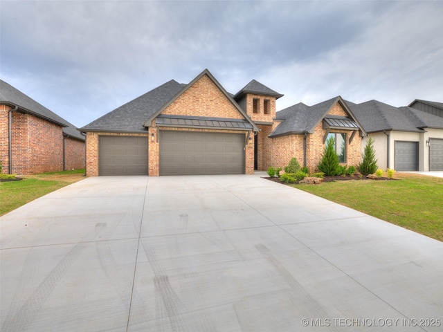 craftsman inspired home featuring concrete driveway, brick siding, an attached garage, a shingled roof, and a front yard