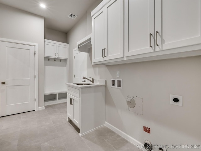 laundry room with hookup for an electric dryer, gas dryer hookup, hookup for a washing machine, and baseboards