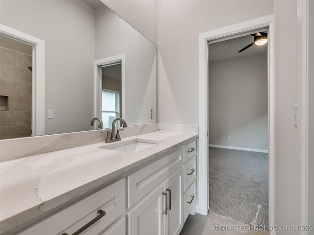 bathroom with a ceiling fan and vanity