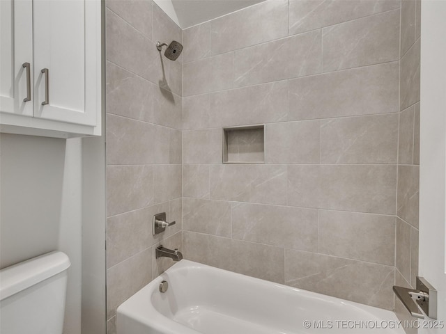 bathroom featuring toilet and washtub / shower combination