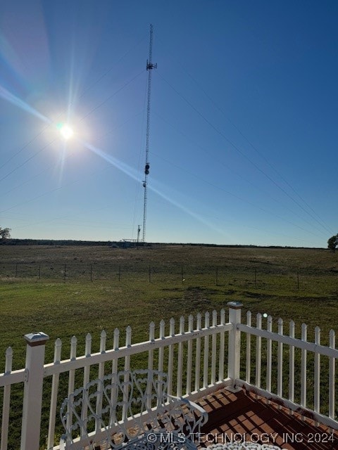 view of yard with a rural view