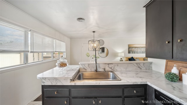 kitchen featuring hanging light fixtures, ornamental molding, and sink