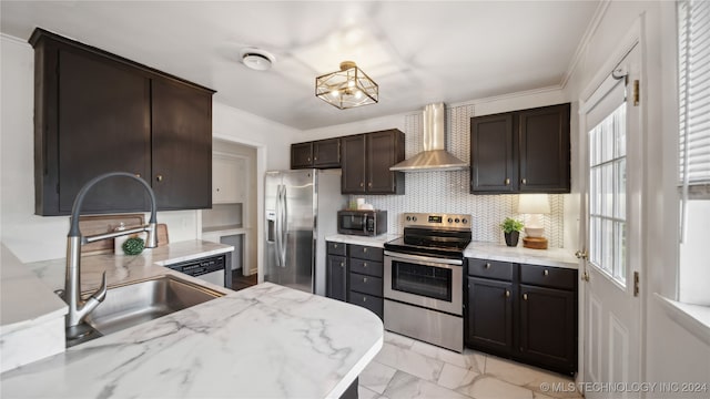 kitchen with sink, stainless steel appliances, crown molding, and wall chimney range hood