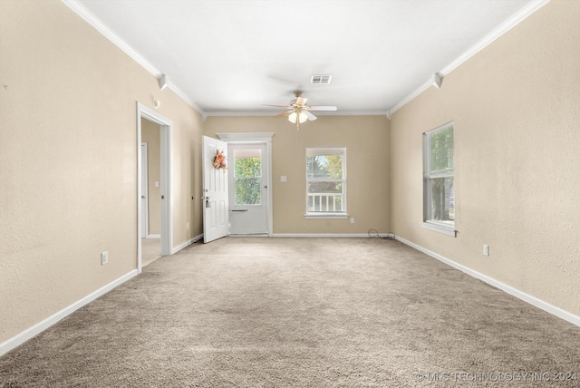 empty room featuring light carpet and ornamental molding