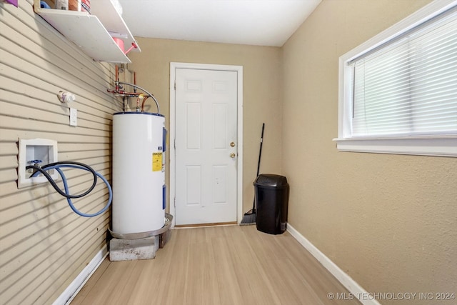 utility room with electric water heater