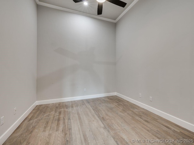 empty room with crown molding, ceiling fan, and light hardwood / wood-style floors