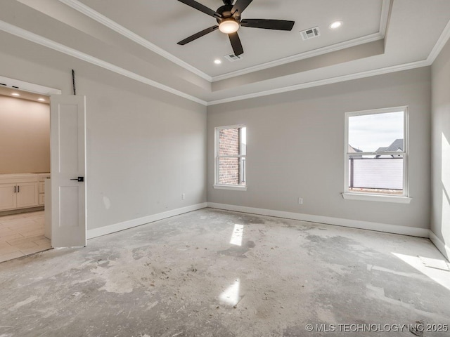 empty room featuring a raised ceiling, crown molding, and ceiling fan