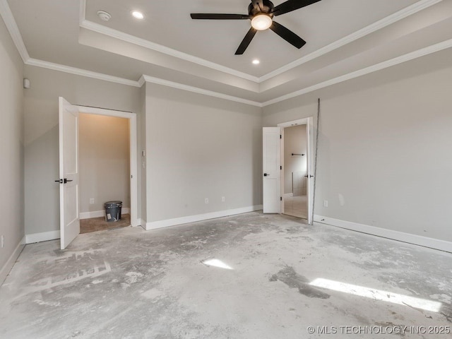 unfurnished bedroom with crown molding, ceiling fan, and a tray ceiling