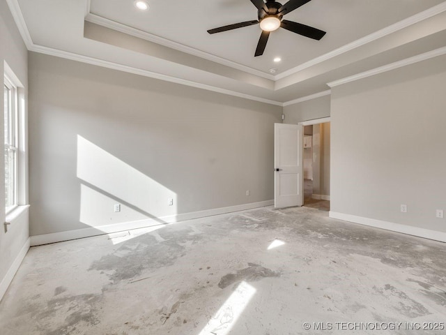 spare room featuring crown molding, a raised ceiling, and ceiling fan