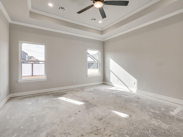 unfurnished room with a raised ceiling, ornamental molding, and plenty of natural light