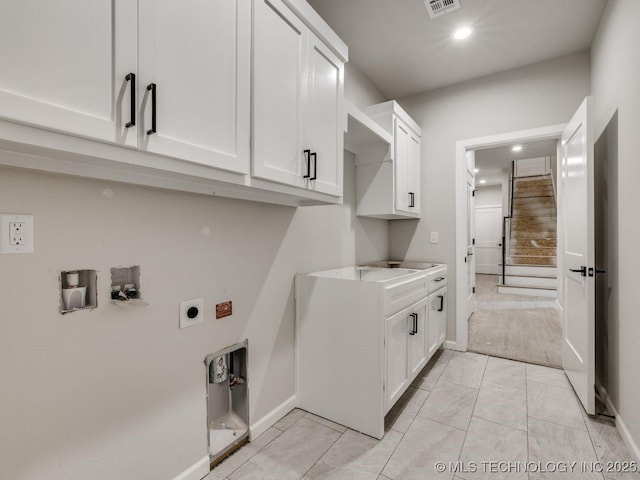 laundry room featuring cabinets and hookup for an electric dryer