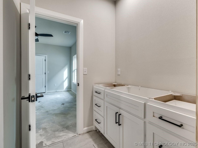 bathroom featuring concrete flooring