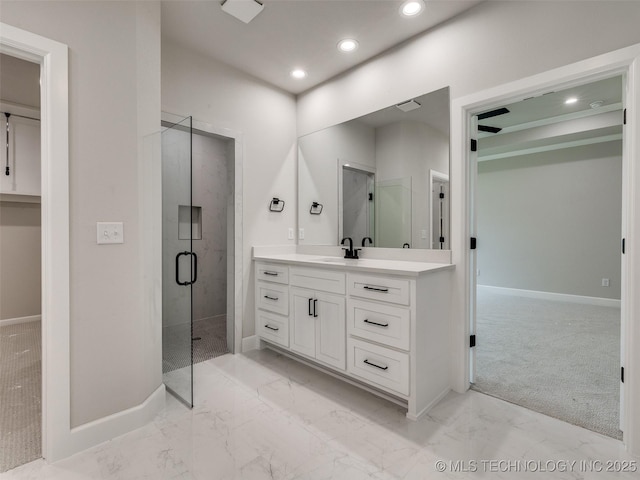 full bath with marble finish floor, baseboards, vanity, and recessed lighting