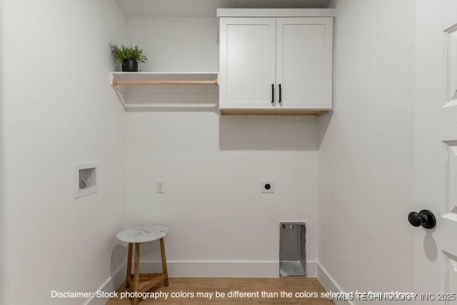 laundry area with washer hookup, cabinet space, hookup for an electric dryer, wood finished floors, and baseboards