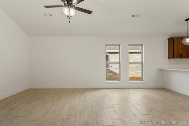 spare room featuring light hardwood / wood-style floors and ceiling fan