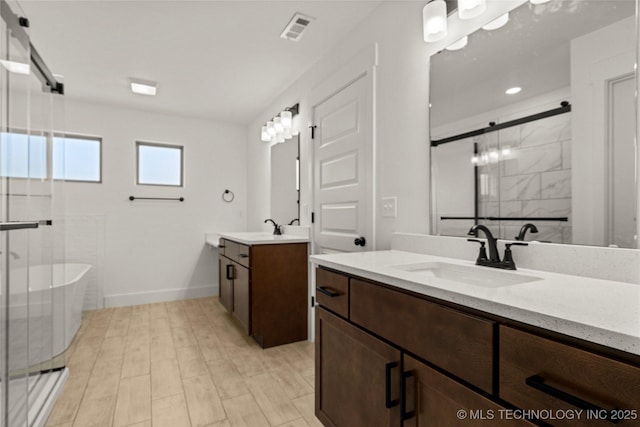 bathroom featuring independent shower and bath and vanity