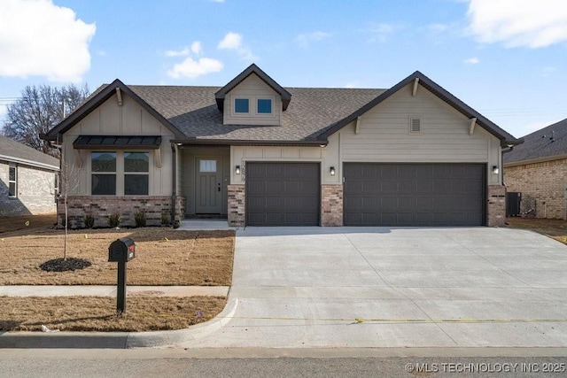 craftsman-style house featuring a garage and central air condition unit