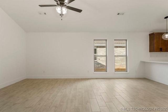 unfurnished room with ceiling fan and light hardwood / wood-style flooring