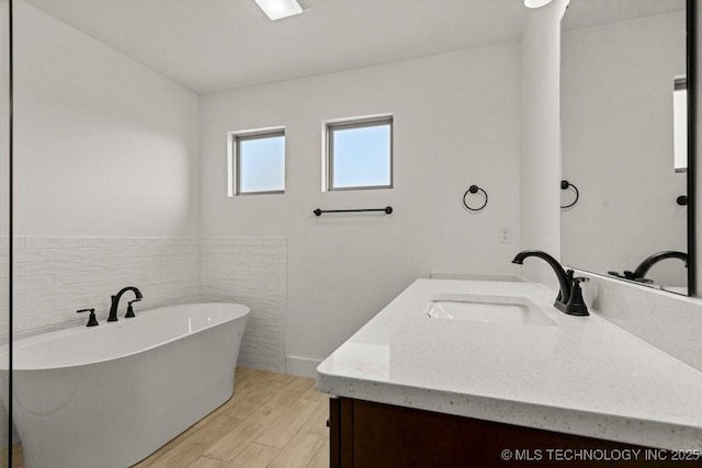 bathroom featuring vanity and a bathing tub