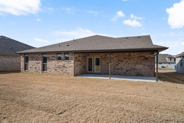 back of house featuring a yard and a patio area