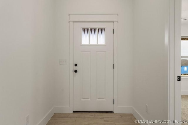 entrance foyer featuring light wood-type flooring