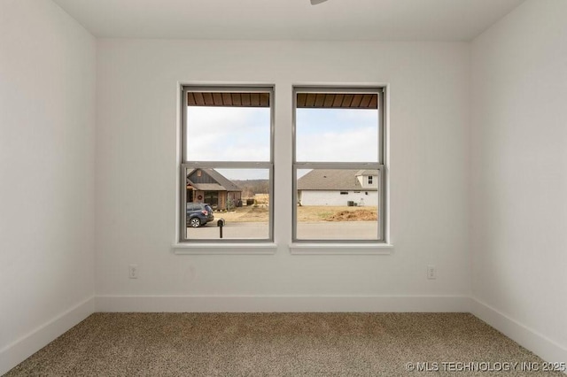 empty room with carpet flooring