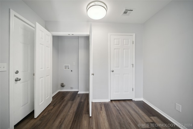 washroom with dark wood-type flooring and washer hookup