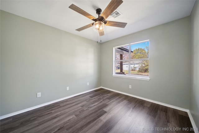 unfurnished room with ceiling fan and dark hardwood / wood-style floors