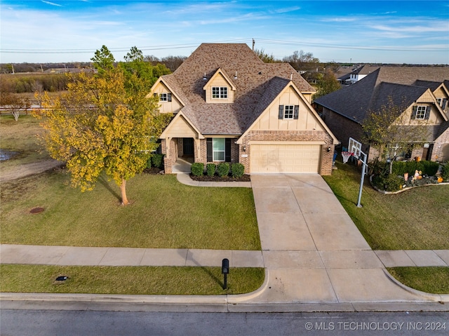 view of front of home with a garage and a front yard