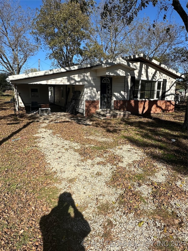 rear view of house with a carport