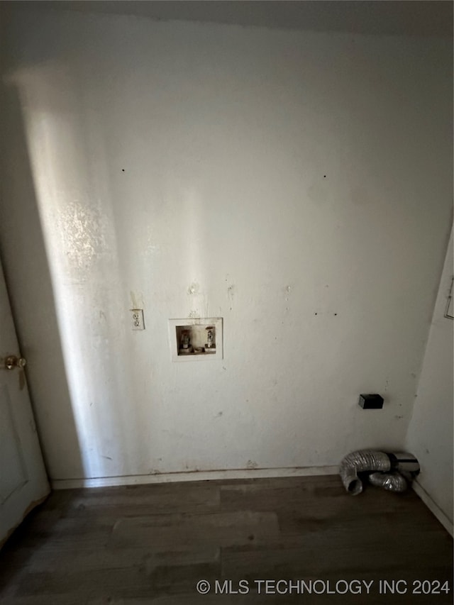 clothes washing area featuring dark wood-type flooring and washer hookup