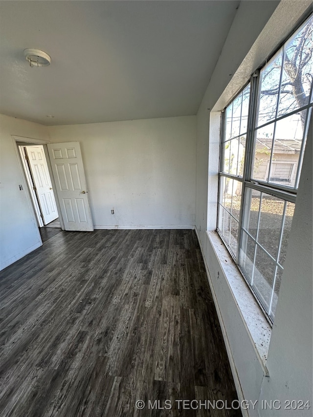 empty room featuring dark hardwood / wood-style floors