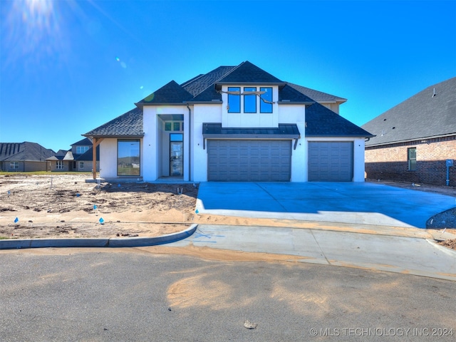 view of front of property with a garage