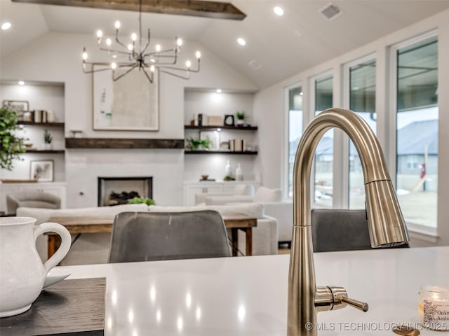 dining space featuring vaulted ceiling