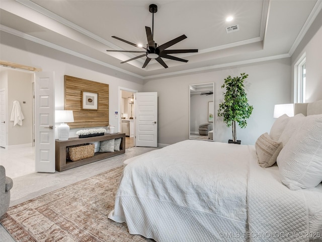 carpeted bedroom featuring ceiling fan, ornamental molding, and a tray ceiling