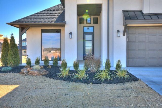 view of exterior entry featuring a garage