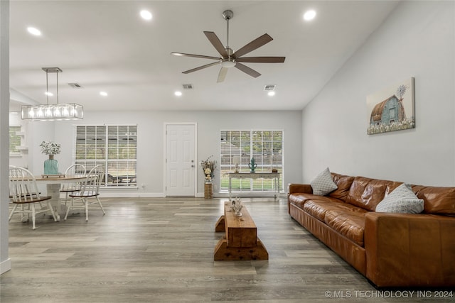 living room featuring wood-type flooring and ceiling fan