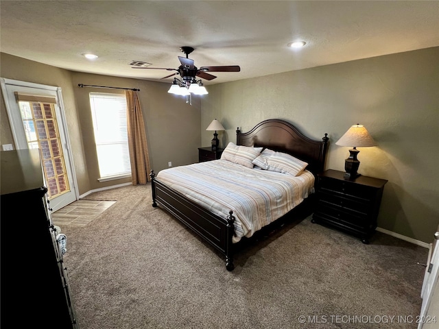 carpeted bedroom featuring ceiling fan