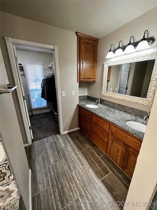 bathroom featuring vanity and wood-type flooring