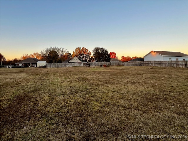 view of yard at dusk