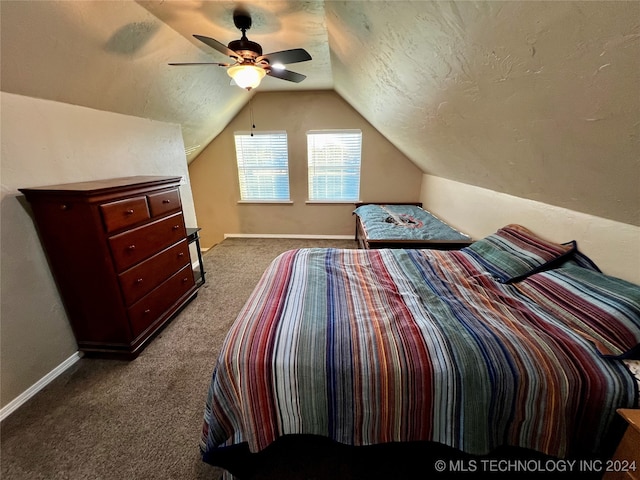 bedroom with carpet flooring, ceiling fan, lofted ceiling, and a textured ceiling