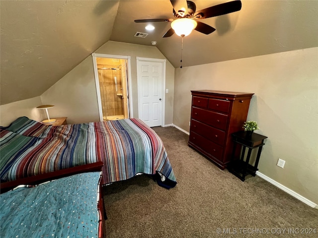 carpeted bedroom featuring connected bathroom, vaulted ceiling, and ceiling fan