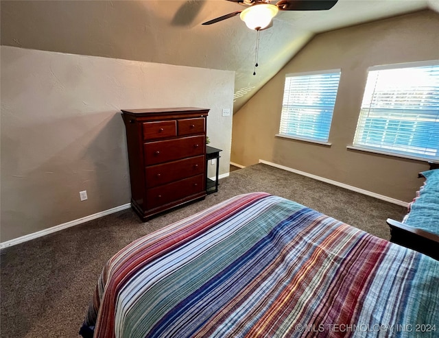 carpeted bedroom featuring ceiling fan and vaulted ceiling