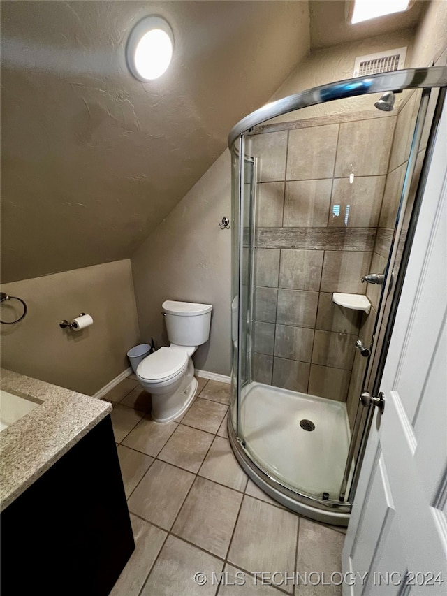 bathroom featuring tile patterned floors, lofted ceiling, an enclosed shower, toilet, and vanity