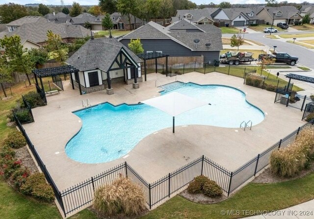 view of swimming pool with a pergola and a patio area